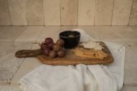 Kaboompics - Red Grapes, Olives and Cheese Board on Stone