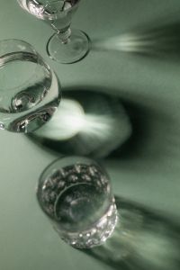 Kaboompics - Abstract Glass Reflections and Light Patterns on Green