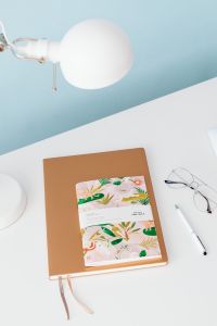 Kaboompics - Brown Journal with Illustrated Planner, Glasses and White Pen
