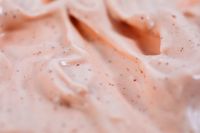 Kaboompics - Soft-Focus Peach Cream Ridges with Sparse Brown Skincare Granules