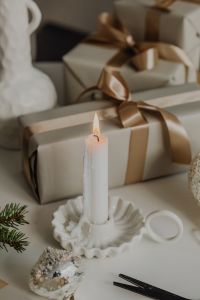 Kaboompics - Shallow Focus Christmas Gift Boxes with Satin Ribbon and Candle, Neutral Background