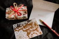 Kaboompics - Christmas Card, Wrapped Gift and Envelope with Red Pen