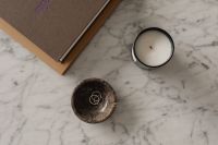 Kaboompics - Overhead Marble Coffee Table Still Life with Candle and Rings