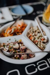 Dishes with various seafood at dinner table, O Camilo Restaurant, Portugal