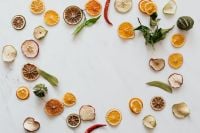 Kaboompics - Dried Fruit Border on White Marble With Copy Space