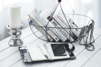 Kaboompics - Open Planner and Book Basket beside a Candle Holder