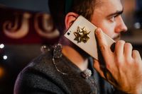 Kaboompics - Side Profile of Man Talking on Phone with Gift Bow