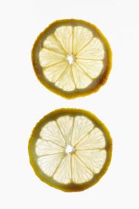 Kaboompics - Two Lemon Slices on White Background