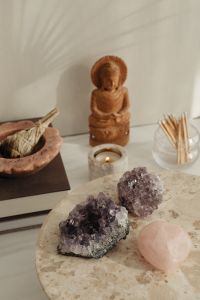 Kaboompics - Wooden Buddha With Candle Crystals And Palm Shadows
