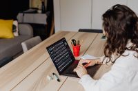 Kaboompics - Woman Working on Laptop at Wooden Table