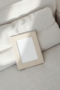 Kaboompics - Portrait Speckled Photo Frame Mockup on Textured Sofa