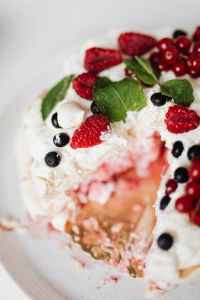 Kaboompics - Close Detail of Pavlova’s Berry Topping and Cut Meringue Layers