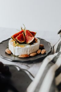 Kaboompics - Camembert with Fig Wedges and Almonds, Shallow Depth of Field