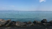 Kaboompics - Calm Blue Garda Lake And Rocky Shore Captured On iPhone