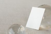 Kaboompics - Wide Business Card Mockup Framed by Clear Glass Spheres