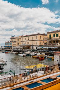 Kaboompics - Small Boats in a Naples Harbor Beneath Historic Buildings