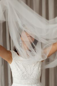 Kaboompics - Bride Lifting Layers of Tulle for a Creative Wedding Portrait