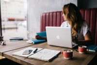 Kaboompics - Young woman working in a cafe