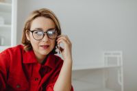 Kaboompics - Woman on Smartphone with Copy Space in Bright Home Office