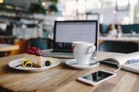 Kaboompics - Working in a restaurant: Macbook, iPhone, Cheese Cake and Cup of Coffee