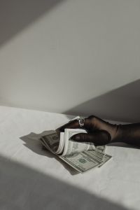 Kaboompics - Money Aesthetic Hand Holding Cash