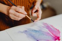 Kaboompics - A woman paints with watercolors