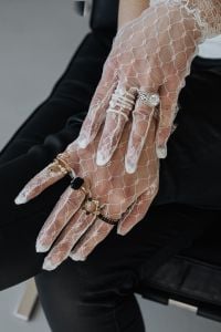 Kaboompics - Lace Gloves and Statement Rings Posed on a Black Leather Chair