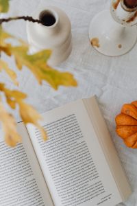 Kaboompics - Close Up of Open Book with Oak Leaves and Orange Pumpkin