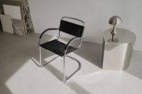 Kaboompics - Black Leather Lounge Chair with Chrome Side Table