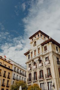 Kaboompics - Ornate Madrid Corner Building with Sculpted Roofline Beneath Blue Sky