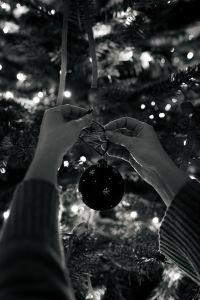 Kaboompics - Hands Cutting Ribbon for Holiday Gift Wrapping