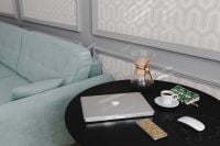 Kaboompics - Laptop, Chemex Coffee and Green Notebook on Black Round Table beside a Pale Blue Sofa