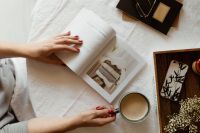 Kaboompics - Woman read book and drink coffee