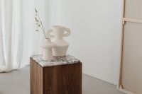 Kaboompics - Minimalist Wooden Side Table with Marble Top and White Ceramic Vases