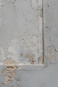 Kaboompics - Gray Wall Corner with Peeling Paint and Exposed Plaster, Weathered Texture Background