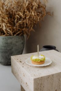 Kaboompics - Small Cake with a Candle and Dried Flowers