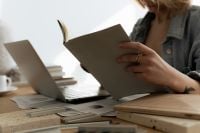 Kaboompics - Interior Design Catalog and Material Samples beside Laptop