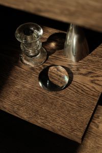 Kaboompics - Glass and Silver Decorative Objects on a Dark Wood Shelf