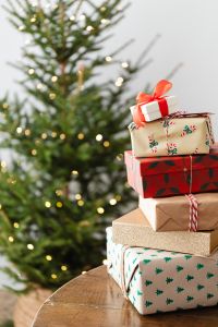 Kaboompics - Stack of Wrapped Gifts Beside a Decorated Christmas Tree