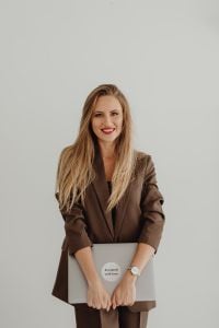 Kaboompics - Business Portrait of Interior Stylist With Laptop on White Background