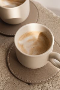 Kaboompics - Close Up of Latte Foam in a Cream Ceramic Cup