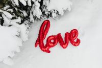 Kaboompics - Red LOVE Balloon on Snowy Ground in Winter Forest