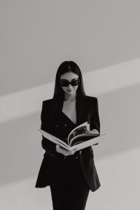 Kaboompics - Black and White Fashion Portrait of a Woman Reading a Magazine