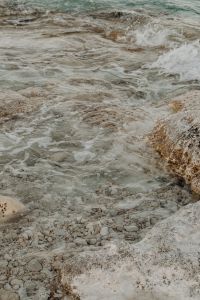 Kaboompics - Foamy Water Flowing into a Pebble-Filled Rocky Inlet