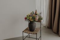 Kaboompics - Charcoal Vase and Pastel Bouquet in a Neutral Living Room