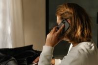 Kaboompics - Woman Taking Work Call Beside Leather Bag