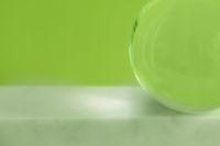 Kaboompics - Minimal Green Abstract Background with Glass Sphere