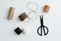 Kaboompics - Black, White And Natural Jute Twine Spools With Scissors