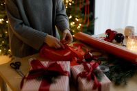 Kaboompics - Wrapping Red Present beside Decorated Christmas Tree