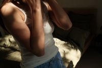 Kaboompics - Woman Adjusting Her Hair during a Morning Routine